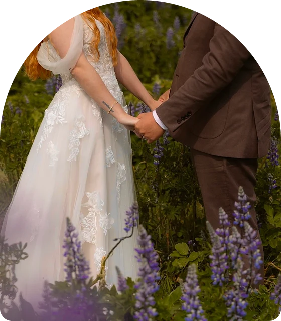 bride and groom hold hands