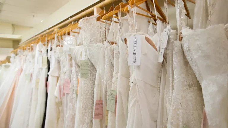 rack of wedding dresses with various neckline options