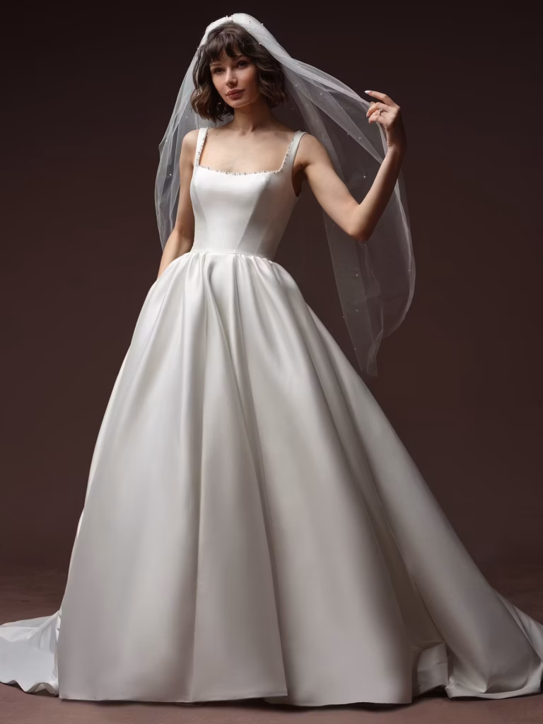 Zurielle by Maggie Sottero strapless satin A-line wedding dress with a structured bodice and timeless bridal silhouette.