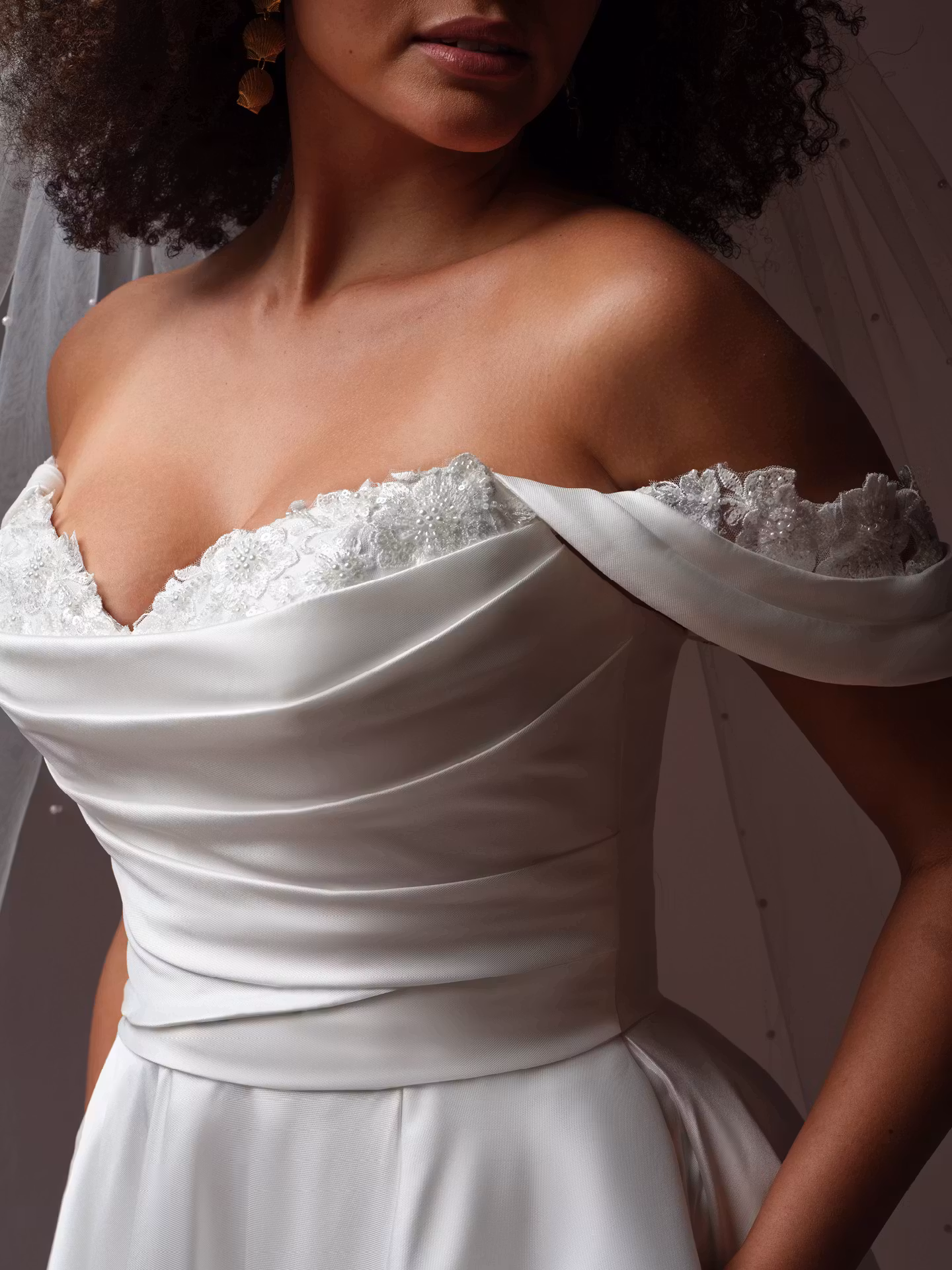 Daphne by Rebecca Ingram draped Mikado A-line wedding dress with a sweetheart neckline, subtle beaded lace, hidden pockets, and optional off-the-shoulder sleeves.