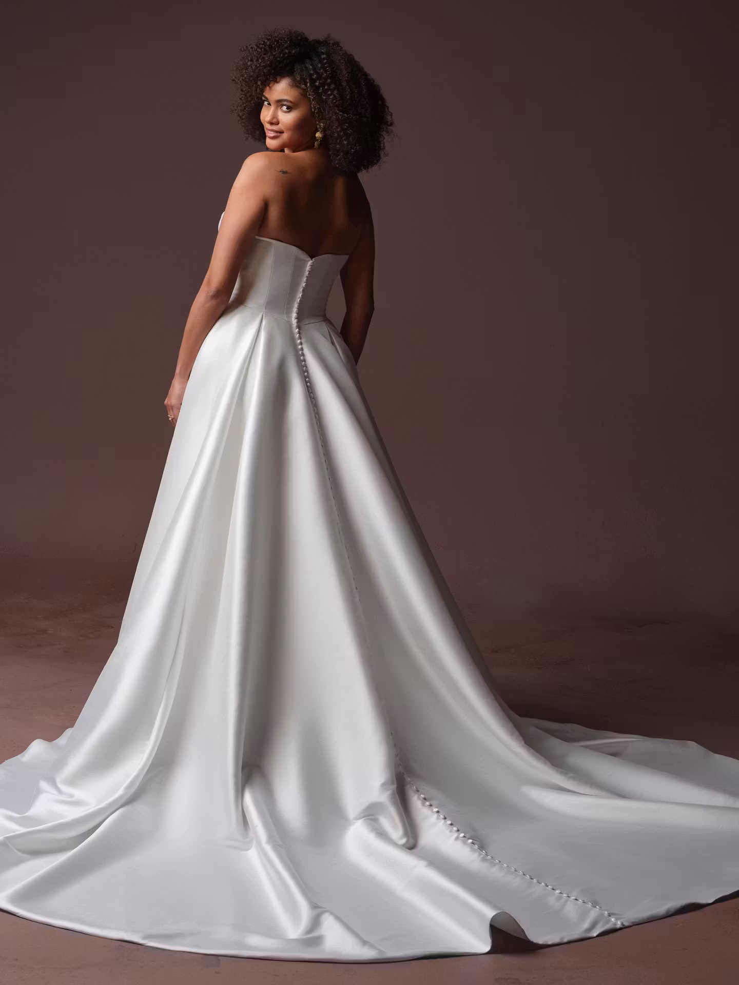 Daphne by Rebecca Ingram draped Mikado A-line wedding dress with a sweetheart neckline, subtle beaded lace, hidden pockets, and optional off-the-shoulder sleeves.