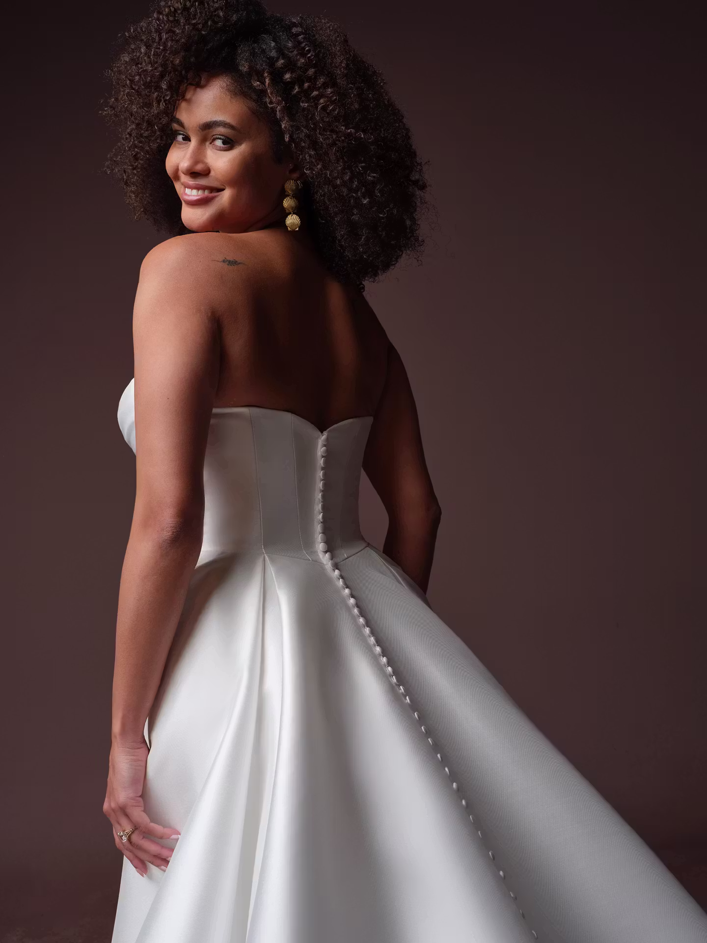 Daphne by Rebecca Ingram draped Mikado A-line wedding dress with a sweetheart neckline, subtle beaded lace, hidden pockets, and optional off-the-shoulder sleeves.