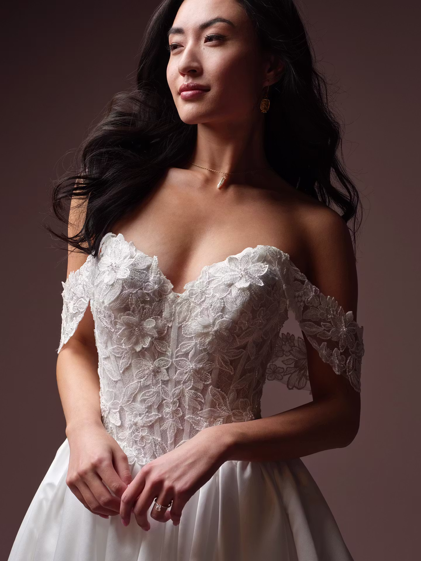 Laurette by Rebecca Ingram satin ball gown wedding dress with Chantilly lace, a sweetheart neckline, illusion lace back, and hidden pockets.