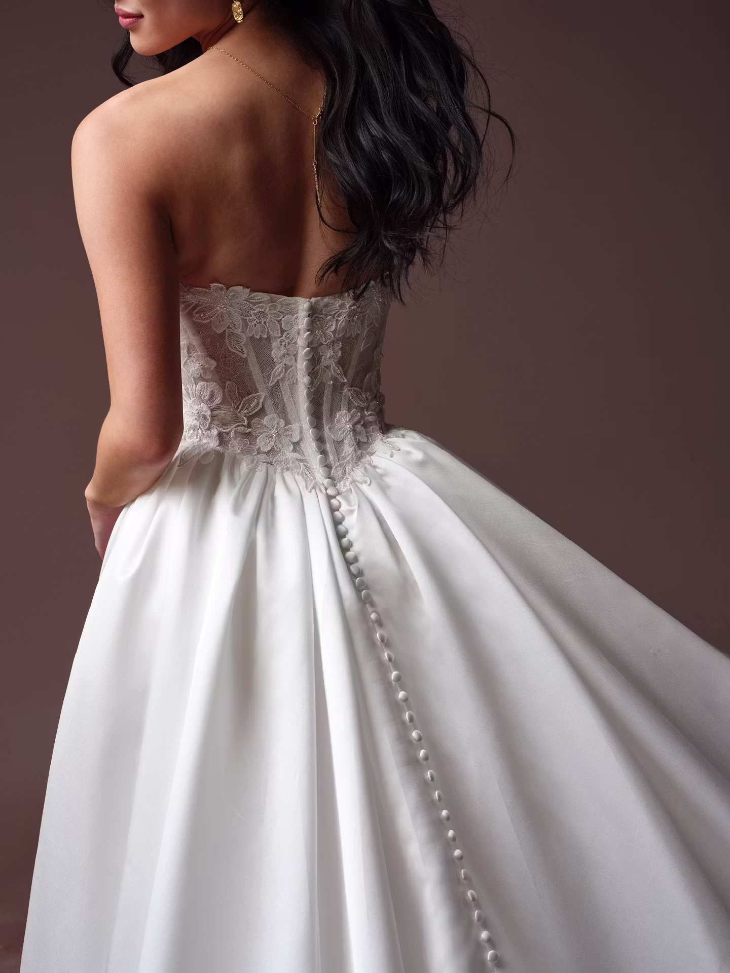 Laurette by Rebecca Ingram satin ball gown wedding dress with Chantilly lace, a sweetheart neckline, illusion lace back, and hidden pockets.
