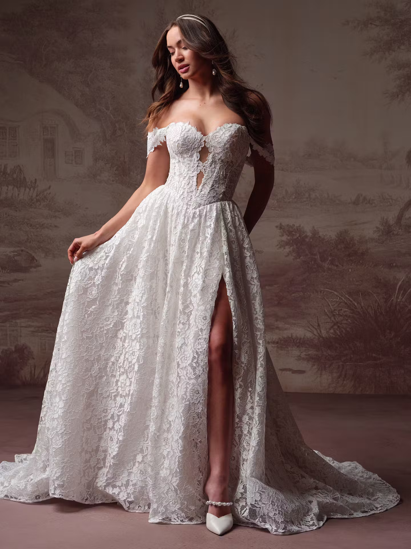 Narelle by Maggie Sottero Chantilly lace A-line wedding dress with a basque waist, sweetheart neckline, hidden pockets, and thigh-high slit.