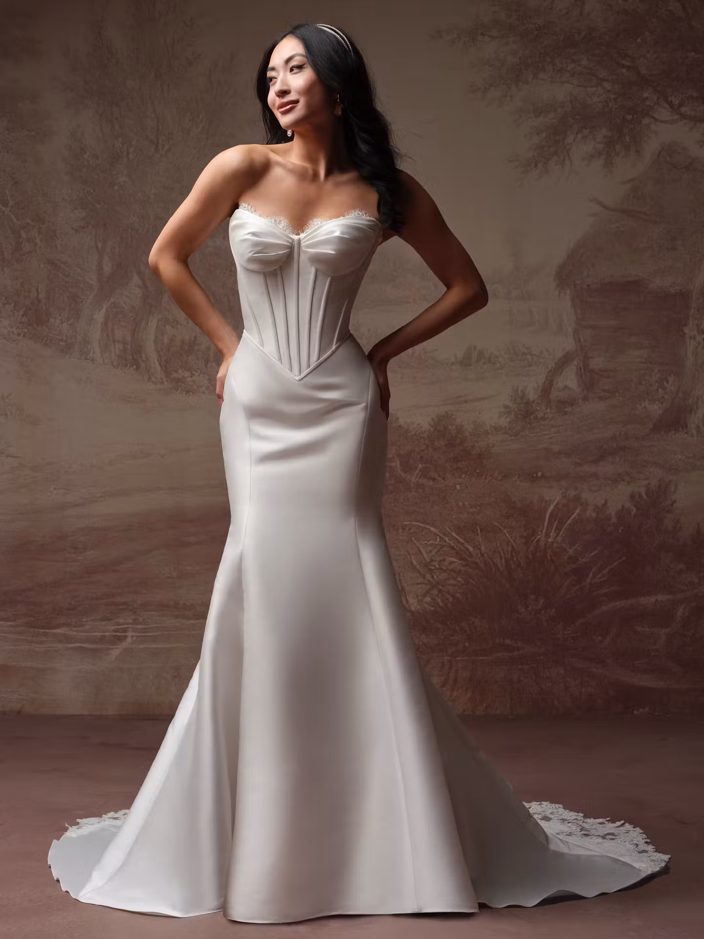 Zorina Lane by Rebecca Ingram Mikado A-line wedding dress with a sweetheart neckline, lace trim, exposed boning, basque waist, and scalloped lace train.