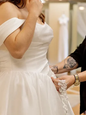 an employee customizes a gown